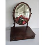 A mahogany toilet mirror with three drawers under