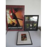 A framed Spiderman poster (2002) and Pulp Fiction poster, along with framed film cells from the TV