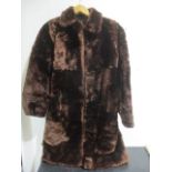 A brown ladies fur coat
