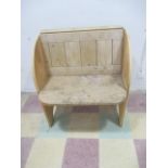 A pine single seat settle