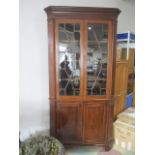 A large inlaid Georgian corner cupboard with glazed top and cupboard under