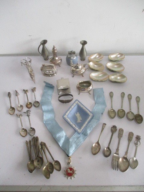 A collection of silver plated items including lighter, candle snuffer, coffee spoons etc.