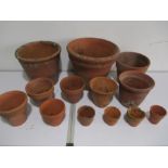 A quantity of terracota garden pots