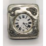 A silver plated Goliath pocket watch with Roman numerals on white enamelled dial, housed in a