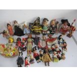 A collection of dolls with a travel theme