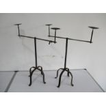 A pair of wrought iron two branch candelabra