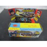 A boxed Corgi rocket firing Batmobile no. 267 with display stand. Rockets and instructions in