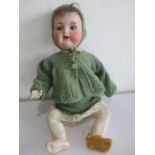 A German Armand Marseille bisque head doll with open mouth, teeth and weighted eyes numbered 990/