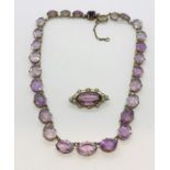 A vintage amethyst coloured necklace in SCM setting along with a similar brooch with seed pearl