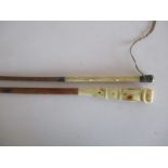 An early 20th century riding crop with ivory handle along with another similar in the form of a belt
