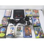 A Sega Mega Drive 2 (16-Bit), along with several games including Sonic, FIFA Football, Streets of