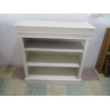 A painted freestanding bookcase
