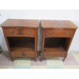 A pair of reproduction bedside cabinets with shaped tops
