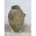 A large terracotta olive jar, 75 cm height