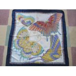 A Salvatore Ferragamo silk scarf with butterfly motif