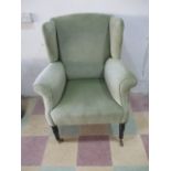 A Victorian upholstered wing back armchair