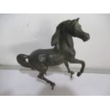 A bronzed figure of a prancing horse, approx 15cm length