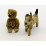 A miniature Schuco jointed teddy bear along with a dog