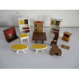 A small collection of wooden dolls house furniture etc.