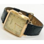 An 18ct gold square faced Jaeger - Le Coultre automatic gentleman's wrist watch stamped 147950 to
