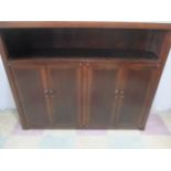 An Oriental hardwood cupboard with shelf over