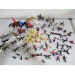 A quantity of plastic and lead toys including: cowboys and Indians, Disney etc.