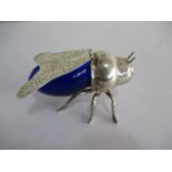 A silver plated and blue glass sugar bowl in the form of a fly, hinged wings as the cover