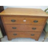 A oak chest of three drawers