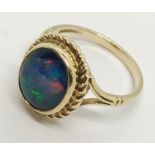 A 9ct gold ring set with an opal