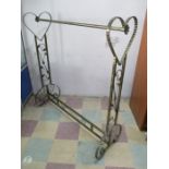 A ornate clothes rail with heart shaped ends