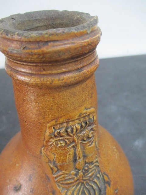 A 17th/18th century Bellarmine jug with bearded mask over armorial- neck repaired- approx 23cm - Image 14 of 15