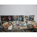 A collection of 12" vinyl records including; Wings, George Harrison, 10cc, Odyssey, Lulu, etc.