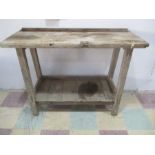 A vintage wooden greenhouse style table