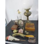 A collection of miscellaneous items including an oil lamp, poker work box, door knobs, soda siphon