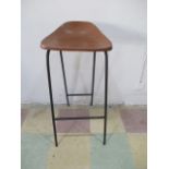 A mid-century metal stool