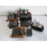 A small collection of camera's including Kodak Six-20 "Brownie" E, Canon, Olympus, along with a