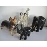 Two ebony elephants, figure of a German Shepherd dog and a Staffordshire flatback