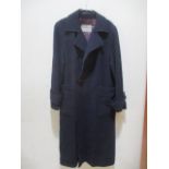 A ladies Aquascutum coat in navy and aubergine with three missing buttons