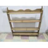 A freestanding pine set of shelves