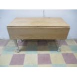 A vintage gateleg pine table with small drawer A/F