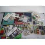 A collection of five stamp albums along with an assortment of cigarette cards etc