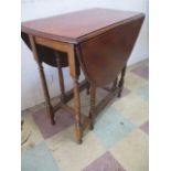 A small oval gateleg table