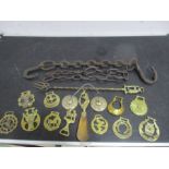 A collection of horse brasses, Tibetan cymbals, antique chain etc.