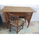 An oak writing desk along with a rush seated chair