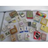 A collection of vintage playing cards and games