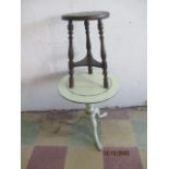 A small carved oak occasional table, along with one other