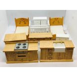 A collection of various dolls house furniture including children's bedroom and kitchen furniture