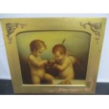 An Oleograph of cherubs in a gilt frame