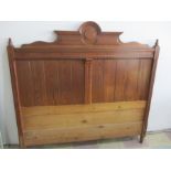 A Victorian pitch pine double headboard
