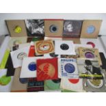 A collection of 7" vinyl singles including The Beach Boys, Yes, U2, Erasure, Nazareth, Madonna, etc